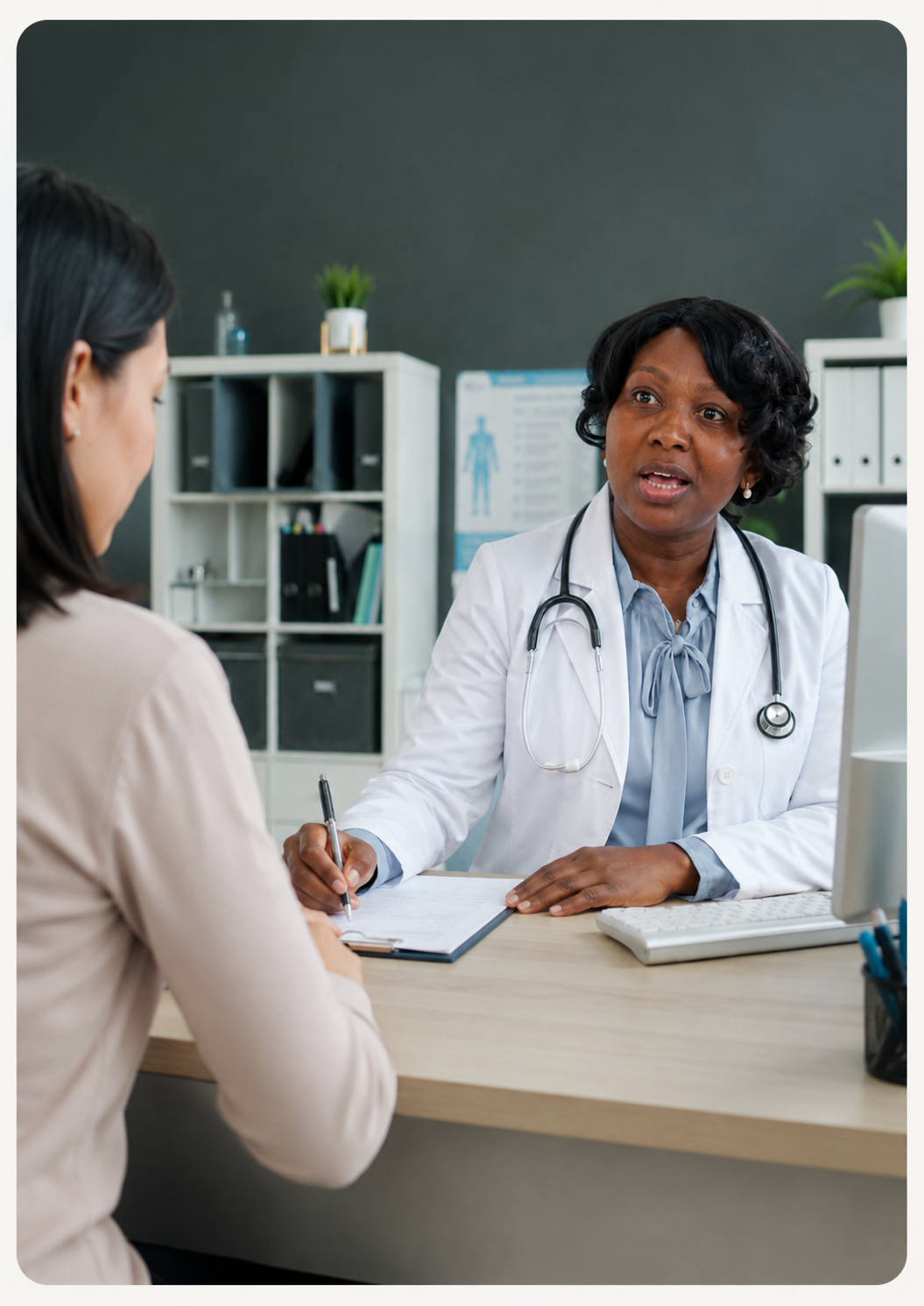 Dr Mabe consulting with a patient